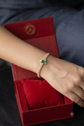 Exquisite golden bracelet features a striking, geometric green stone center 💛💚