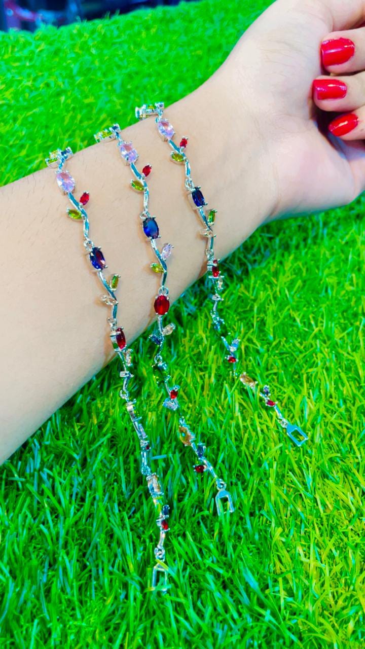Elegant silver-tone bracelet featuring vibrant tulip-inspired multicolor crystal stones, beautifully crafted🌷✨